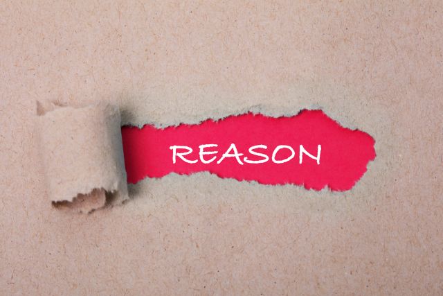 破れた紙から見えるRESONと書かれた文字